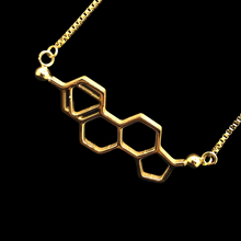 Load image into Gallery viewer, The Estrogen Necklace in Gold by Salceology. Necklace is adjustable, hypoallergenic, versatile, non-tarnish, water-resistant and high quality. This piece can be worn as a statement piece on it's own or stacked with your other personalised jewellery for an authentic look. Featuring the Estrogen Necklace in Gold.